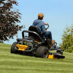 Man operating Cub Cadet Z3 54 S zero turn mower with steering wheel control and 24HP Kawasaki engine. Built for slopes and larger blocks. Available at Mower City Albury.