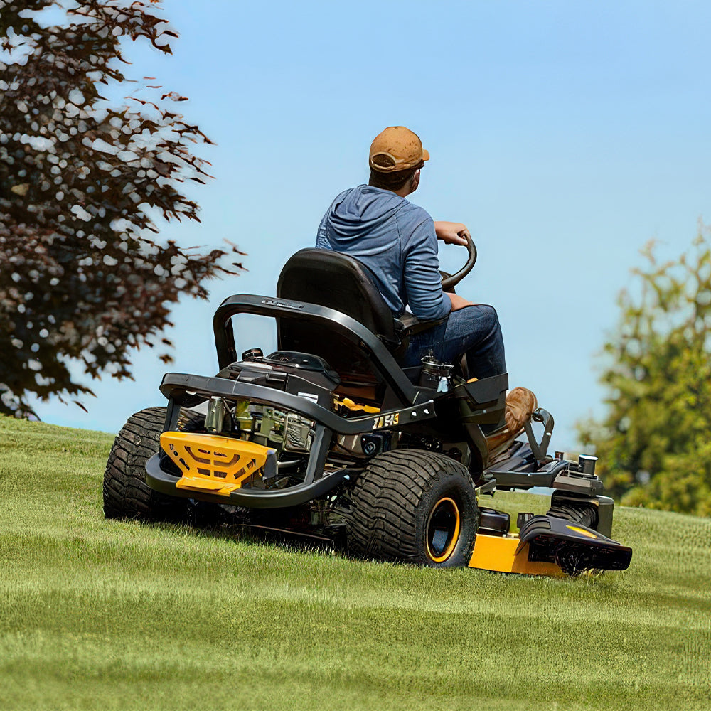 Man operating Cub Cadet Z3 54 S zero turn mower with steering wheel control and 24HP Kawasaki engine. Built for slopes and larger blocks. Available at Mower City Albury.