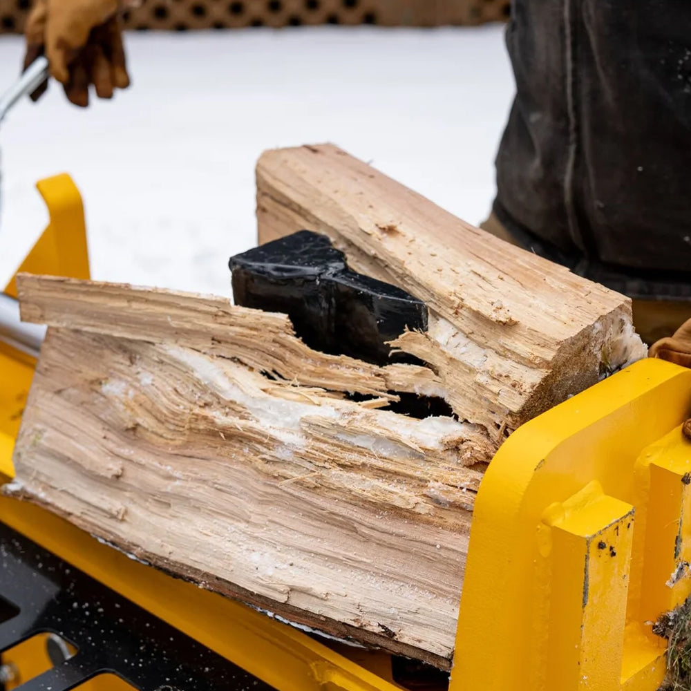 Wood being split by DEWALT 28 ton hydraulic log splitter with Kohler 196cc engine and 13-second cycle time. Built for firewood and heavy splitting. Available at Mower City Albury. 
