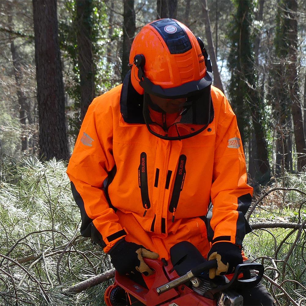 In action Solidur Waterproof, breathable orange work jacket rated EN 343 Class 3. Hood fits over a helmet, taped seams, 7 pockets. Mower City Albury.