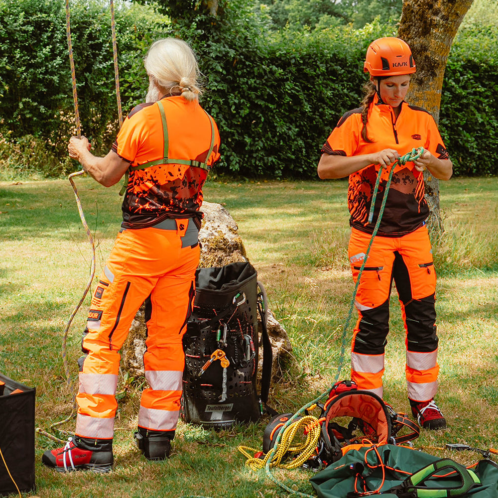 on model arborists: Solidur short sleeve Lightweight fluorescent work polo in orange Quick drying, UPF 40+ sun protection. Mower City Albury.