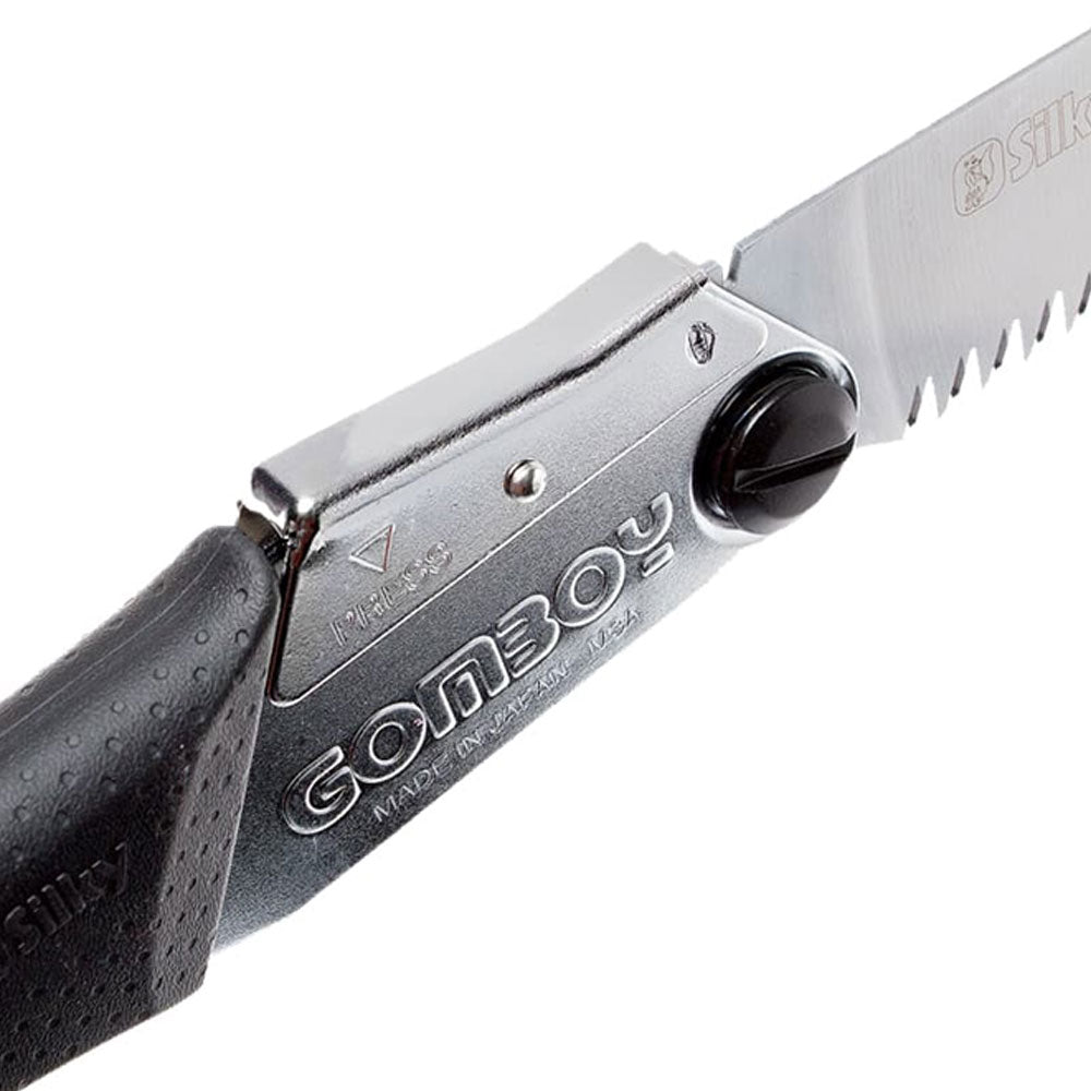 Discover the versatile Gomboy Medium-Tooth Folding Silky Saw for pruning, carpentry, and on-the-go tasks. Enjoy smooth, quick cuts with its hollow ground blades and rust prevention. Conveniently store it in the hinged carrying case. Experience superior grip, even in wet conditions, thanks to the special Gom rubber formula. Visit Mower City Albury today! close up