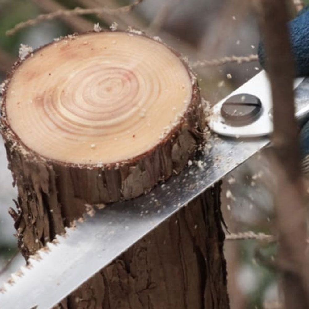 Discover the versatile Gomboy Medium-Tooth Folding Silky Saw for pruning, carpentry, and on-the-go tasks. Enjoy smooth, quick cuts with its hollow ground blades and rust prevention. Conveniently store it in the hinged carrying case. Experience superior grip, even in wet conditions, thanks to the special Gom rubber formula. Visit Mower City Albury today! in action