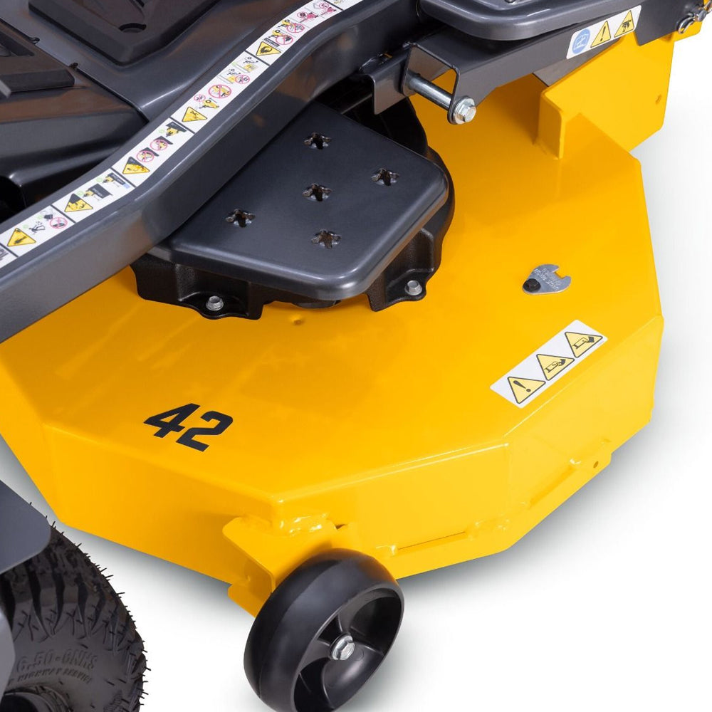 Close-up of a cub cadet Z2 42 S lawn mower deck with warning labels, the number 42 on the side, and a black wheel visible against a white background. Zero Turn Mower - Talk to Mower City Albury
