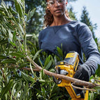 DEWALT 18V XR Power Pruner DCPPP568N-XE – cordless secateur with 32 mm cutting capacity, LED light and ergonomic handle. Skin only. Available at Mower City Albury. Pruner in use