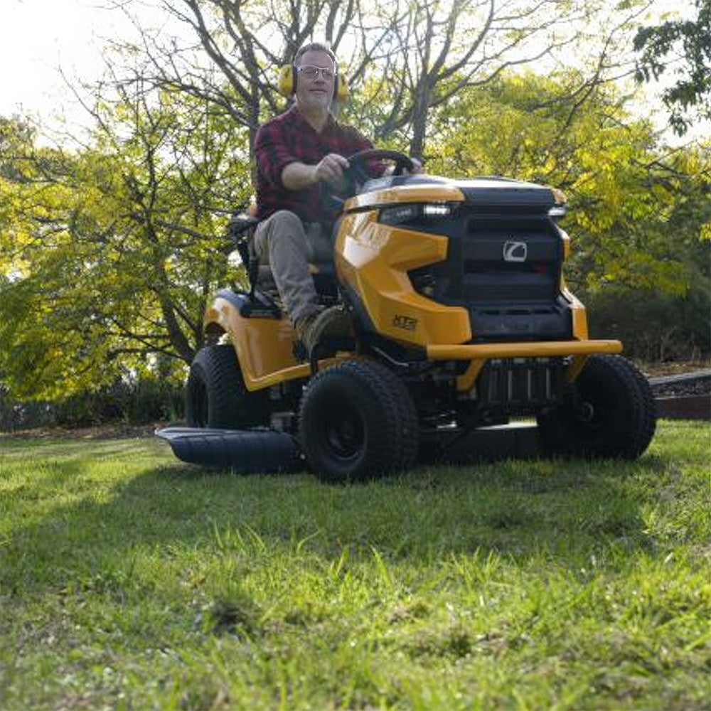 A man riding a Cub Cadet Enduro XT2 42 K ride-on mower with 21.5HP Kawasaki V-Twin engine and 42-inch fabricated deck, suited to large blocks and small acreage. Mower City Albury