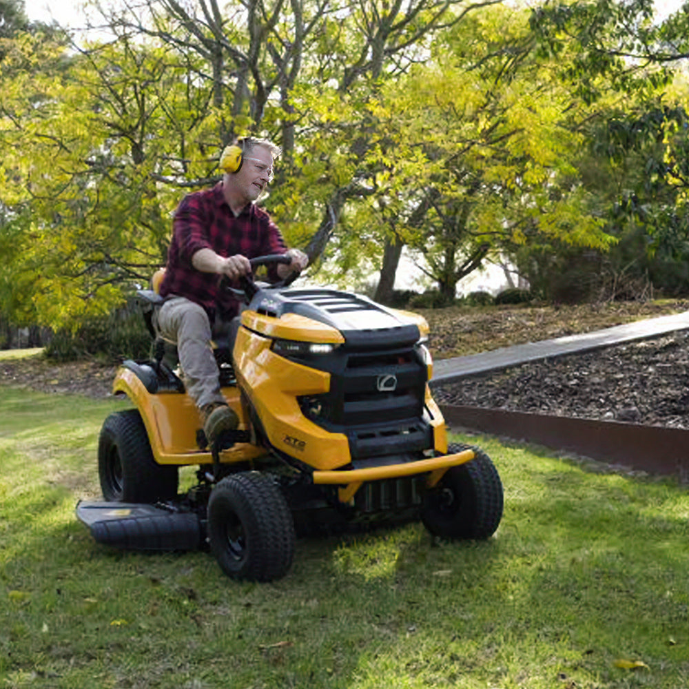 A man riding a Cub Cadet Enduro XT2 42 K ride-on mower with 21.5HP Kawasaki V-Twin engine and 42-inch fabricated deck, suited to large blocks and small acreage. Mower City Albury 2