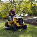 A man riding a Cub Cadet Enduro XT2 42 K ride-on mower with 21.5HP Kawasaki V-Twin engine and 42-inch fabricated deck, suited to large blocks and small acreage. Mower City Albury 2