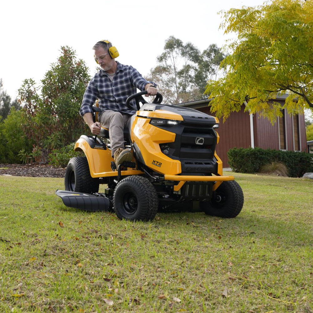 A man riding a Cub Cadet Enduro XT2 42 K ride-on mower with 21.5HP Kawasaki V-Twin engine and 42-inch fabricated deck, suited to large blocks and small acreage. Mower City Albury - wodonga