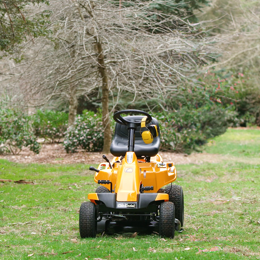 Cub Cadet CC 30 HX Mini Rider with 30-inch deck, 382cc engine and hydrostatic transmission. Talk to the team at Mower City Albury. In a backyard, front view