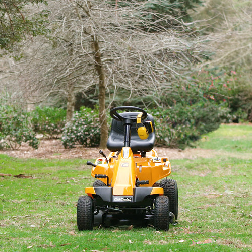 Cub Cadet CC 30 HX Mini Rider with 30-inch deck, 382cc engine and hydrostatic transmission. Talk to the team at Mower City Albury. In a backyard, front view