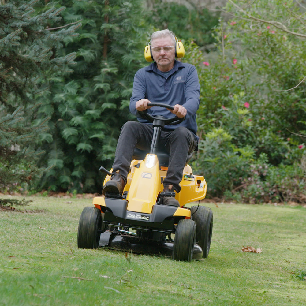 Man sitting on Cub Cadet CC 30 HX Mini Rider with 30-inch deck, 382cc engine and hydrostatic transmission. Talk to the team at Mower City Albury. 