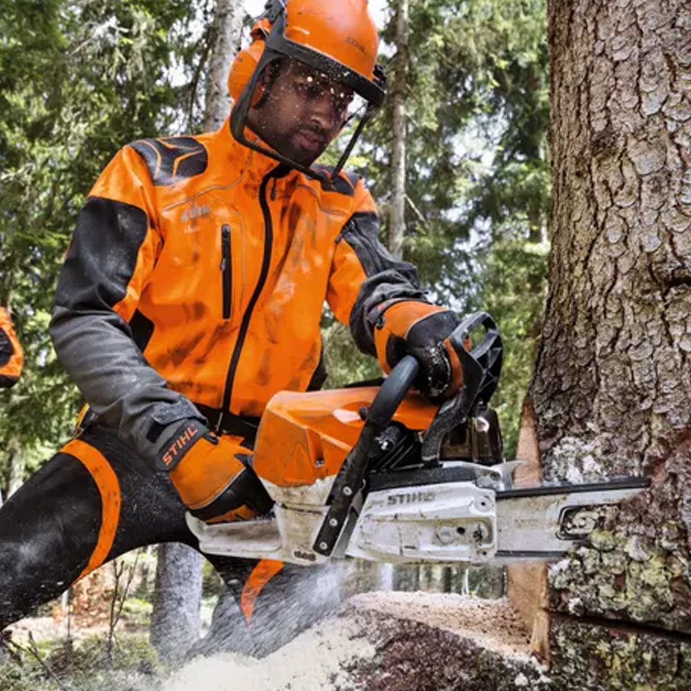Person in orange safety gear using a STIHL MS 46chainsaw to cut a tree in a forest setting C M Petrol Chainsaw. Mower City Albury
