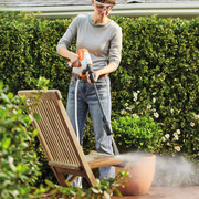 STIHL RCA 20 Battery Pressure Cleaner Kit with tank, nozzle, battery, and carry bag – available at Mower City Albury Wodonga online and in-store cleaning wooden chair