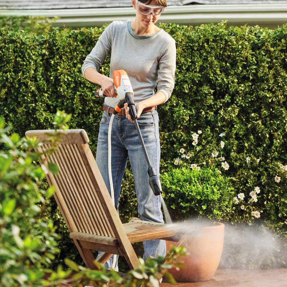 STIHL RCA 20 Battery Pressure Cleaner Kit with tank, nozzle, battery, and carry bag – available at Mower City Albury Wodonga online and in-store cleaning wooden chair