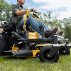 Man riding Cub Cadet Ultima Z2 42 zero-turn mower with 21.5HP Kawasaki engine and 42-inch fabricated deck. Built for blocks up to four acres. Available at Mower City Albury. Close up