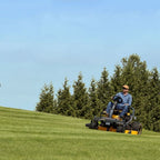 a man driving Cub Cadet Ultima Z3 54 S zero-turn ride-on mower with a 24 HP Kawasaki engine, 54-inch fabricated deck and Syncro Steer. Talk to Mower City Albury. front view