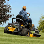 a man driving a Cub Cadet Ultima Z3 54 S zero-turn ride-on mower with a 24 HP Kawasaki engine, 54-inch fabricated deck and Syncro Steer. Talk to Mower City Albury.